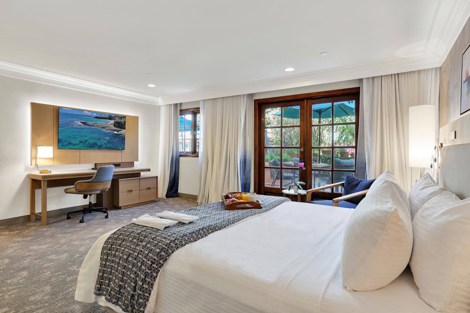 Guest room with a king bed and a work desk