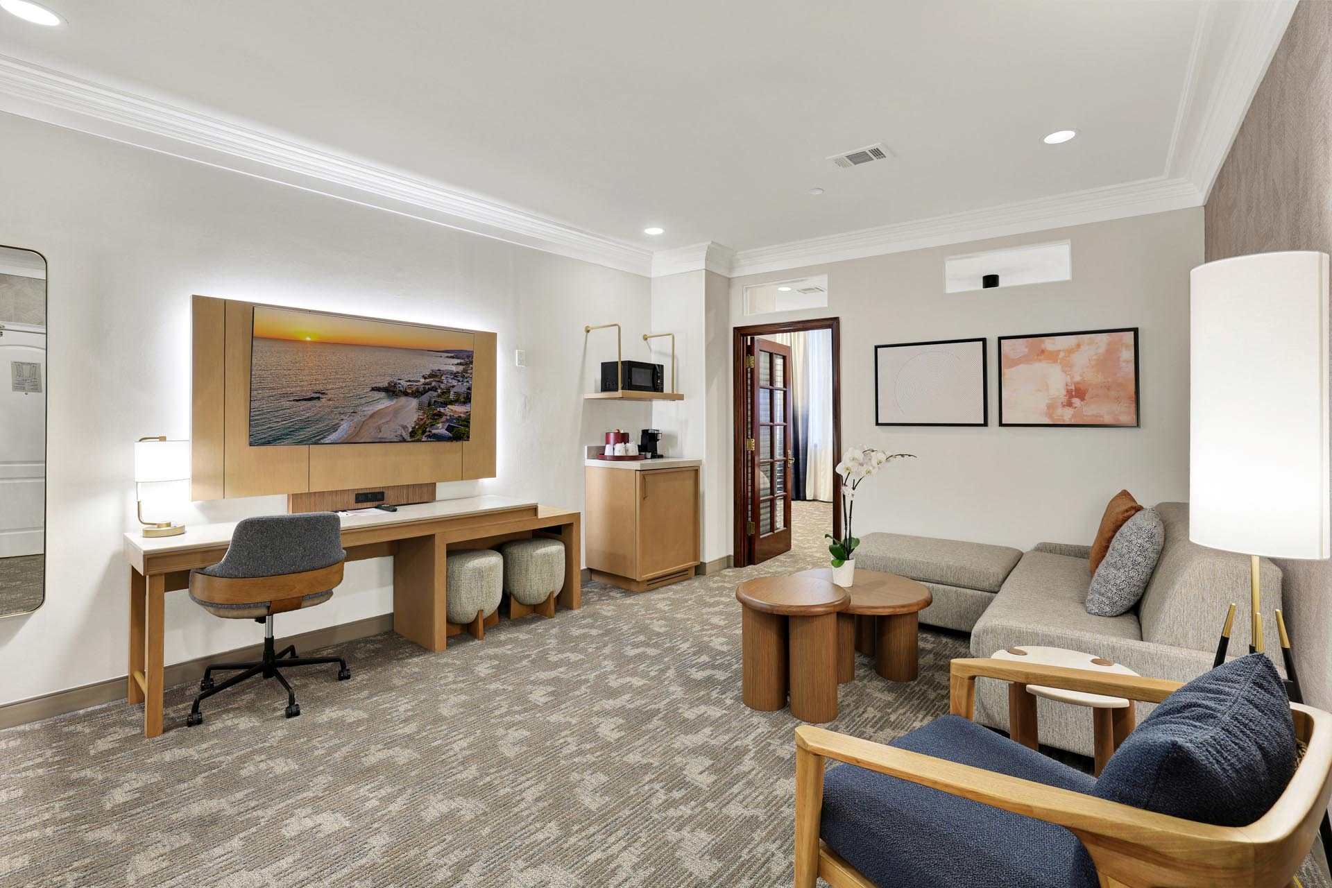 Suite living room with a sofa and a desk