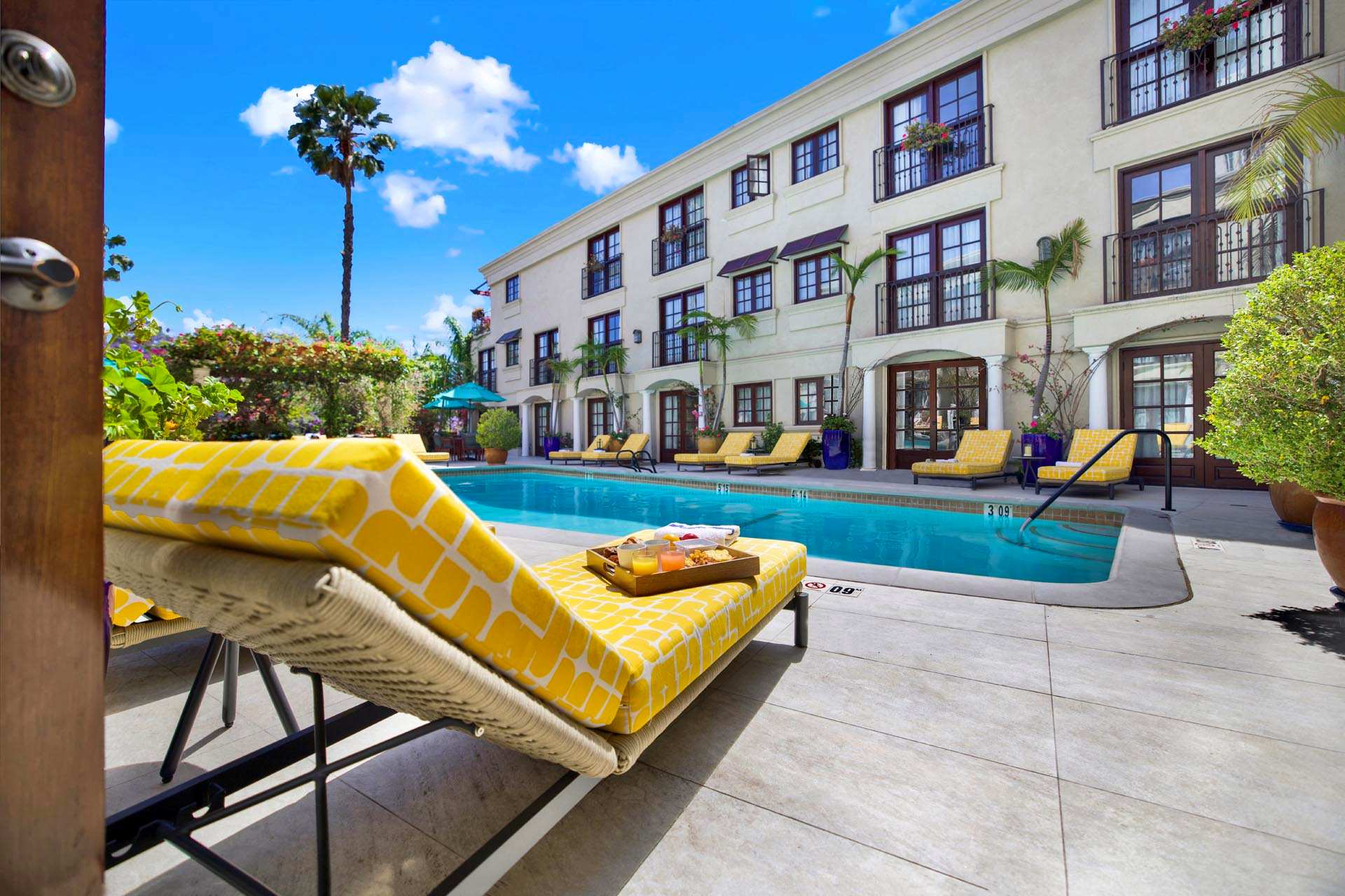 Yellow sun lounger beside the outdoor pool