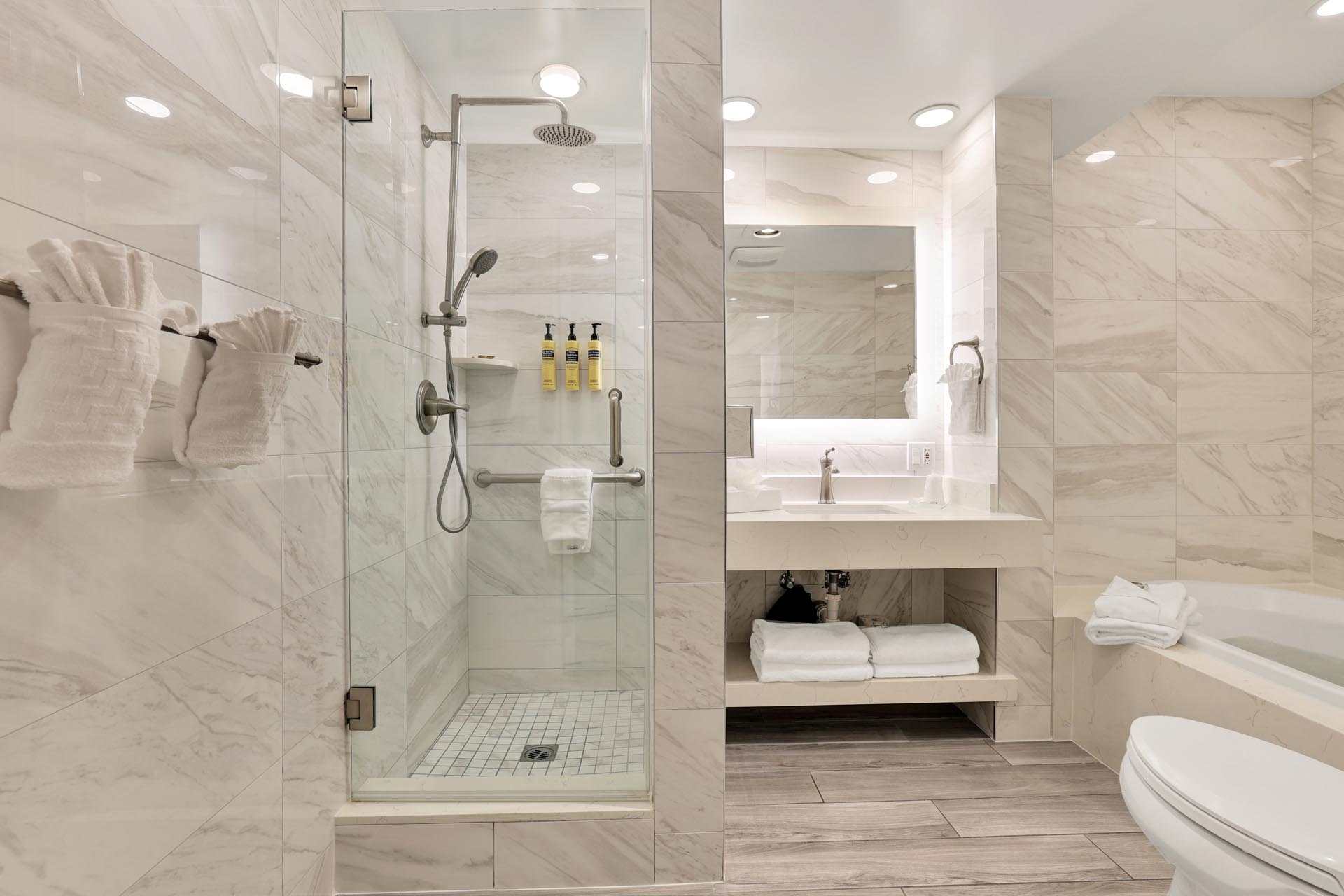 A bathroom with a walk-in shower